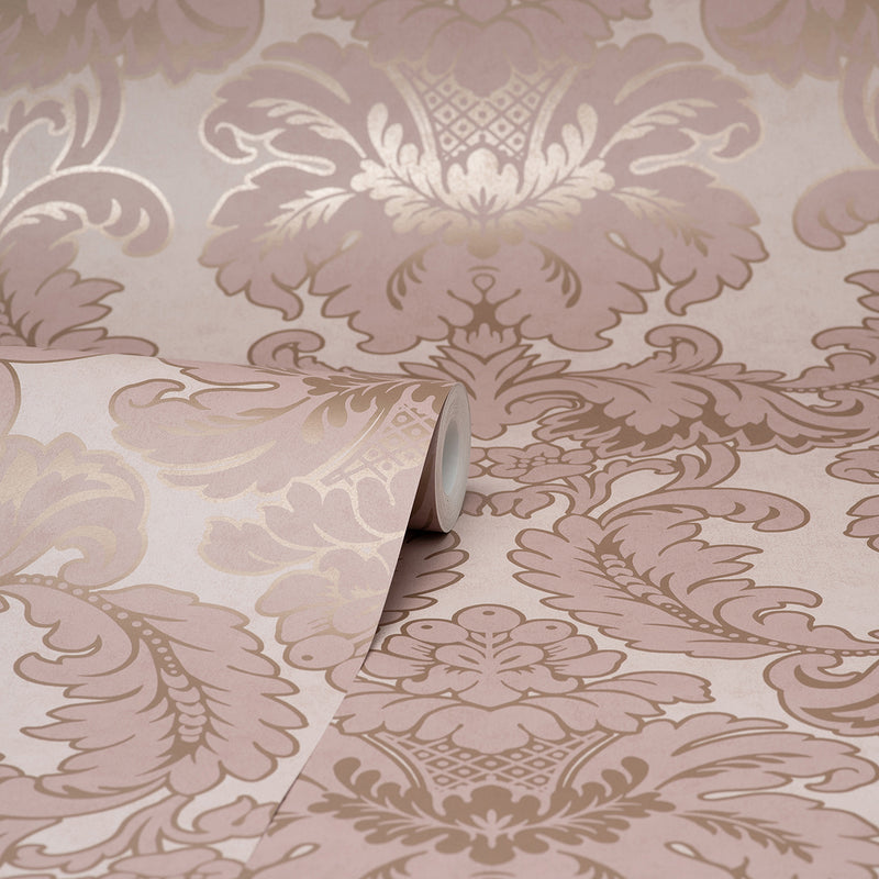 Exquisitely designed, this pink damask wallpaper is a timeless option for interiors. Accented with rose gold inks, this design has an opulent feel. Windsor is an unpasted, non woven wallpaper.